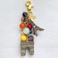 Paris bag charm with colorful beads, Eiffel Tower charm, and Arche de Triomphe charm. Paris keyring for women.