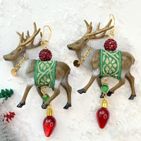 Reindeer earrings with embellished miniature reindeer in green and gold ribbon sashes and gold chain collars. Cute Christmas earrings for women.