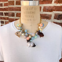 Cute necklace for spring and Easter. Bunny charms on a gold chain and pastel beads.