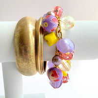 Lenora Dame bracelet. Purple and yellow beaded bracelet with beads wire wrapped on a gold plated steel chain with lobster clasp.