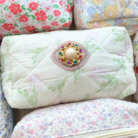 Light green with pink roses floral cotton quilted makeup bag embellished with a round pearl and rhinestone brooch. Cute makeup bags with zipper. Gifts for mom.