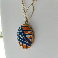 Lenora Dame Orange Fabric Locket