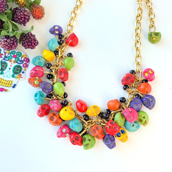 Colorful sugar skull charms on a gold chain necklace. Sugar skull necklace for day of the dead. 