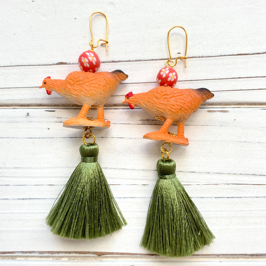 Miniature chicken earrings with red floral bead, orange toy chicken and green silky tassels. Chicken earrings for chicken lovers. 