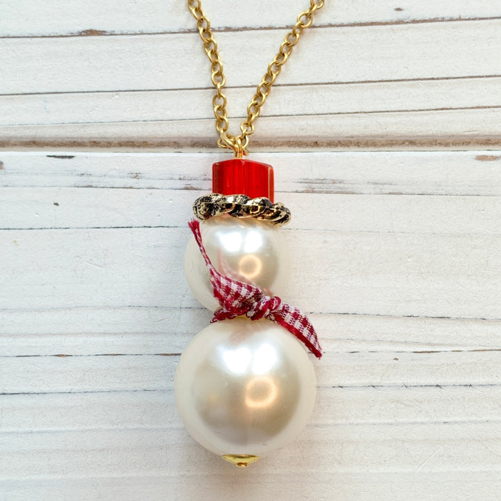 Miniature pearl snowman pendant with top hat and plaid scarf hung on gold chain. Snowman Christmas necklace for women.