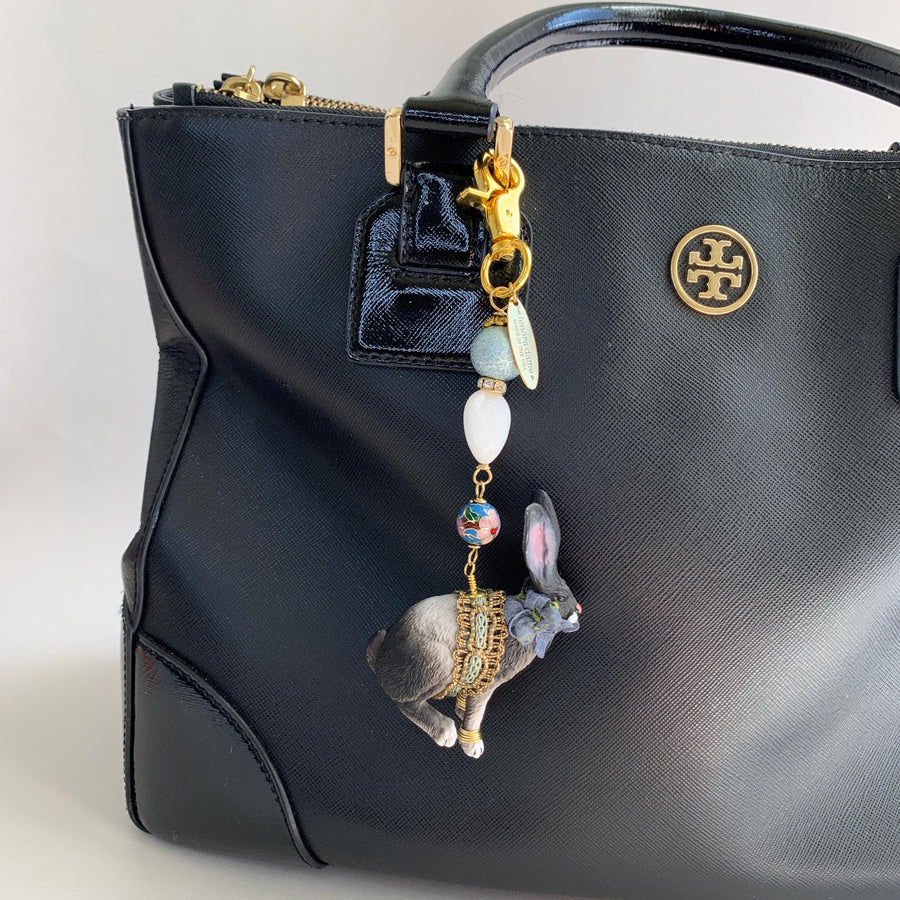 Long eared bunny bag charm with floral ribbon embellishments. Blue beaded rabbit purse charm.