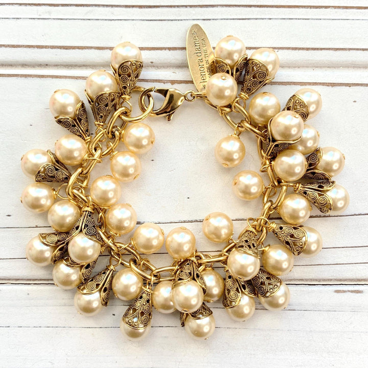Gold charm bracelet with pearls. Pearl bridal party jewelry.