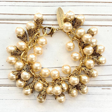Gold charm bracelet with pearls. Pearl bridal party jewelry.