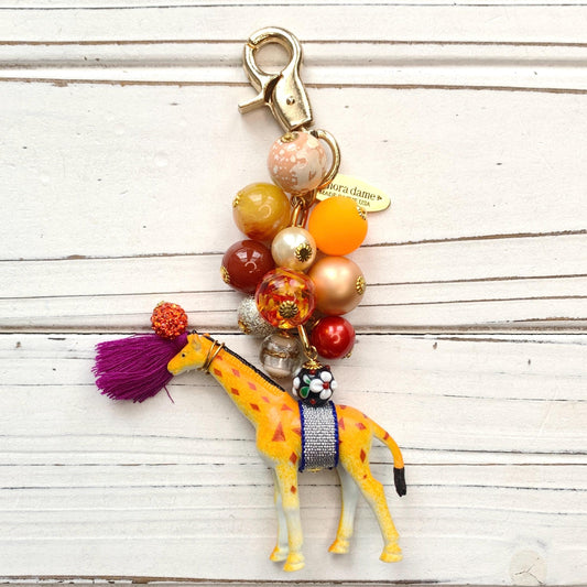 Cute beaded bag charm with embellished giraffe figurine. Lenora Dame bag charms.