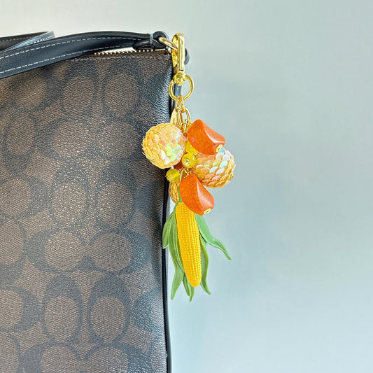 Lenora Dame Corn Bag Charm