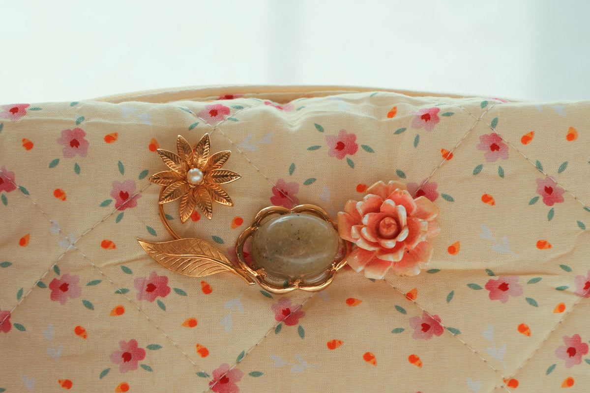 Lenora Dame One-of-a-Kind Brass-toned Daisy Quilted Cosmetic / Makeup bag