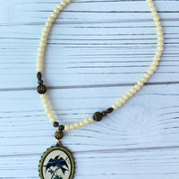 Lenora Dame  Nightshade Warbler Pendant