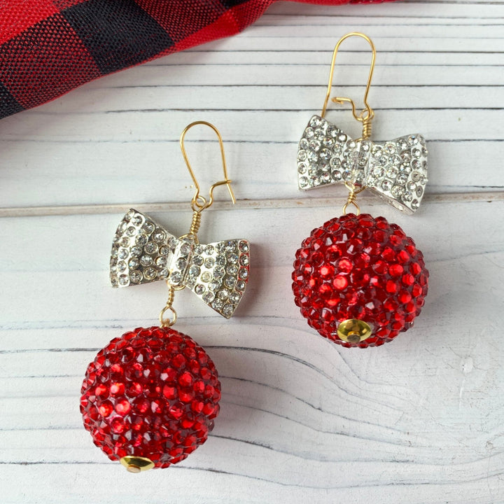 Rhinestone silver bow and red bead drop earrings. Red and silver holiday earrings for women. 