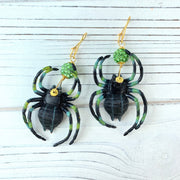 Black spider earrings with green rhinestone pave beads and gold ear wires. Halloween earrings for women.