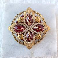 Gold rhinestone brooch with ruby red tear drop beads surrounded by crystal clear rhinestones.. Vintage inspired lapel pin. 