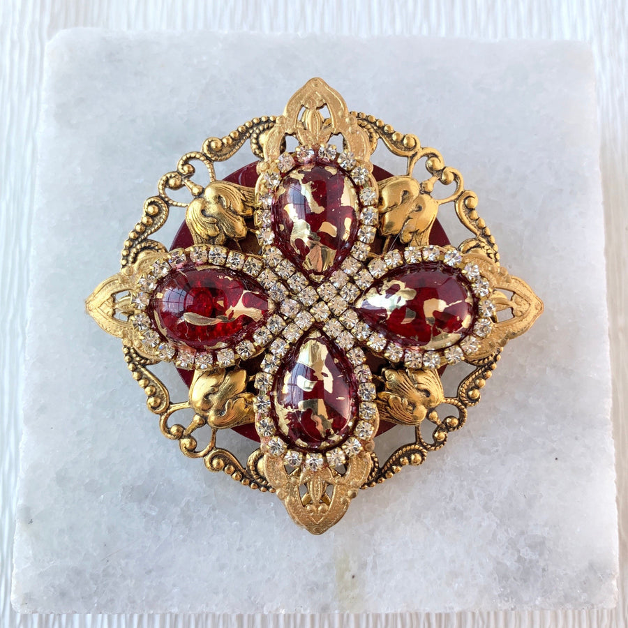 Gold rhinestone brooch with ruby red tear drop beads surrounded by crystal clear rhinestones.. Vintage inspired lapel pin. 